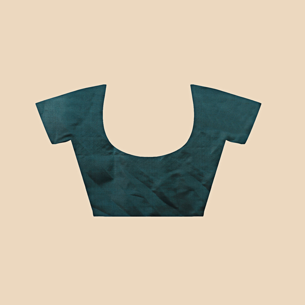 Teal blouse on a beige background