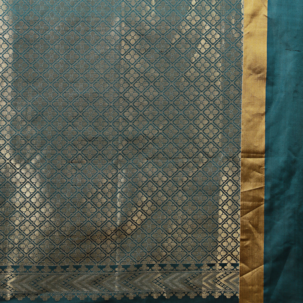Teal fabric with gold geometric pattern