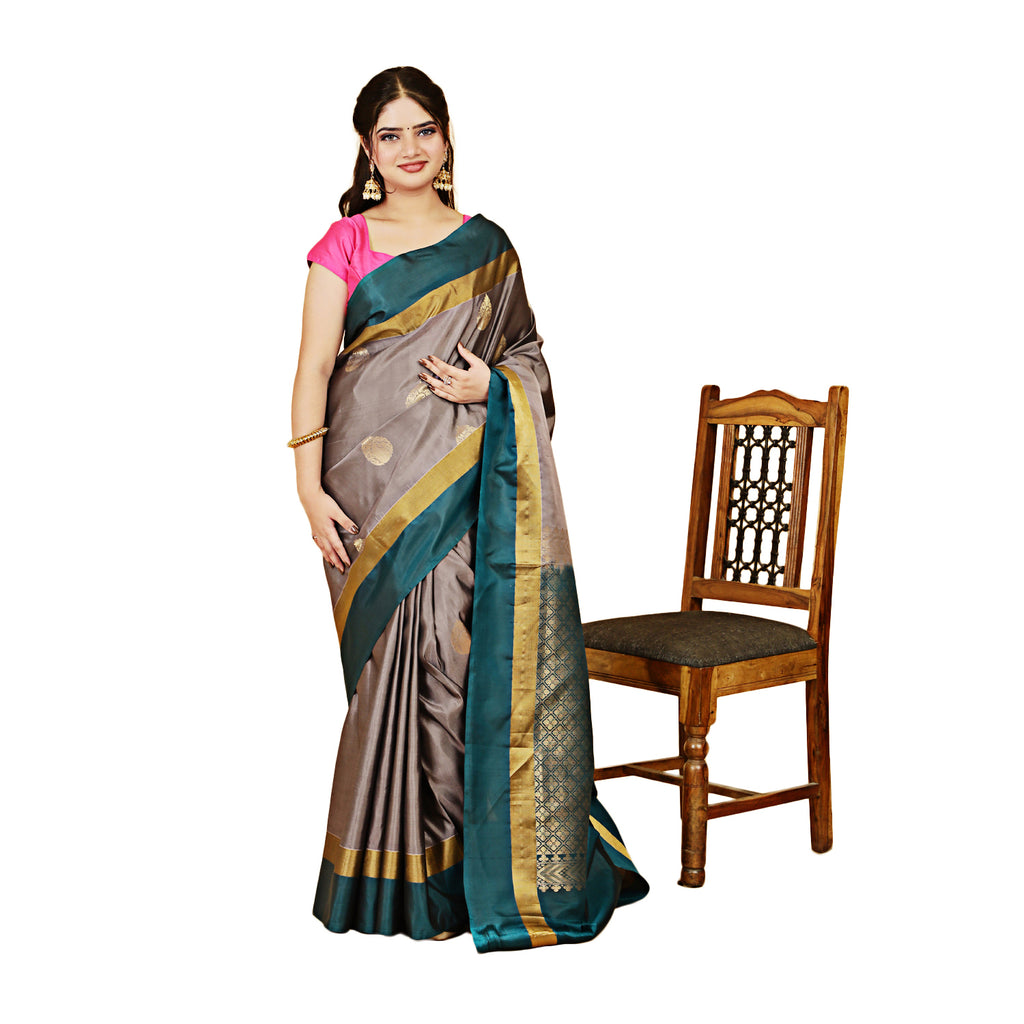 Woman wearing a saree with a chair on a white background